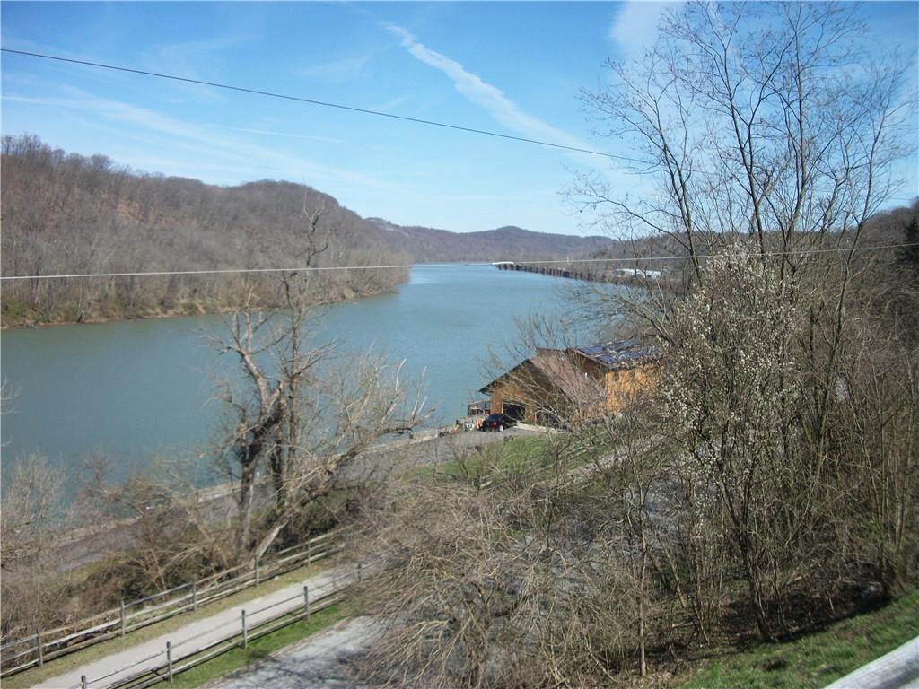 101 Carmichaels Street Rices Landing, PA 15357 - Photo 4 of 28 a view of a lake in middle of forest