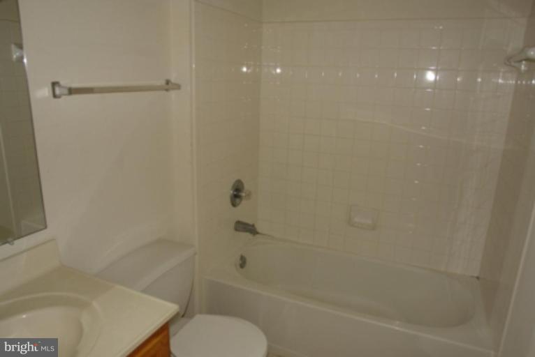 1604 Briarview Court, Unit 64 Severn, MD 21144 - Photo 6 of 10 a bathroom with a shower and a toilet