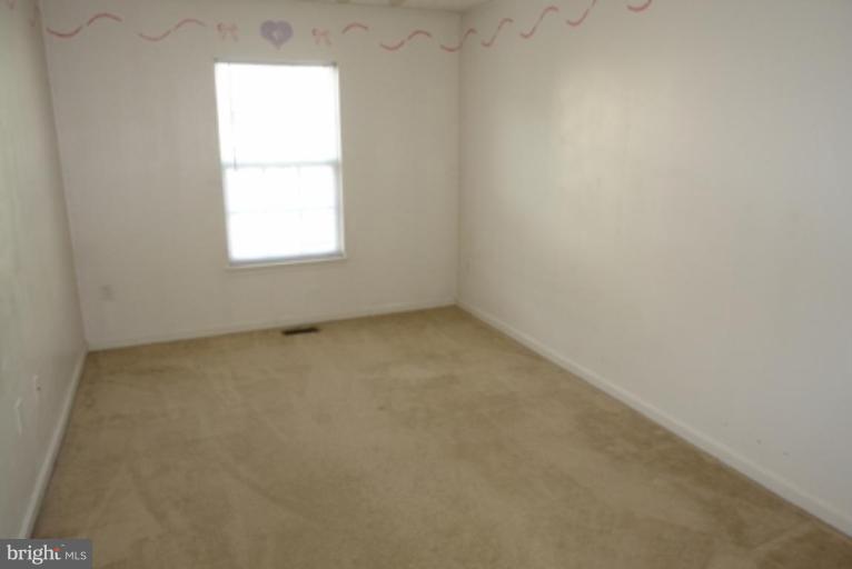 1604 Briarview Court, Unit 64 Severn, MD 21144 - Photo 8 of 10 an empty room with a window