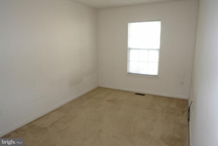 1604 Briarview Court, Unit 64 Severn, MD 21144 - Photo 9 of 10 an empty room with a window