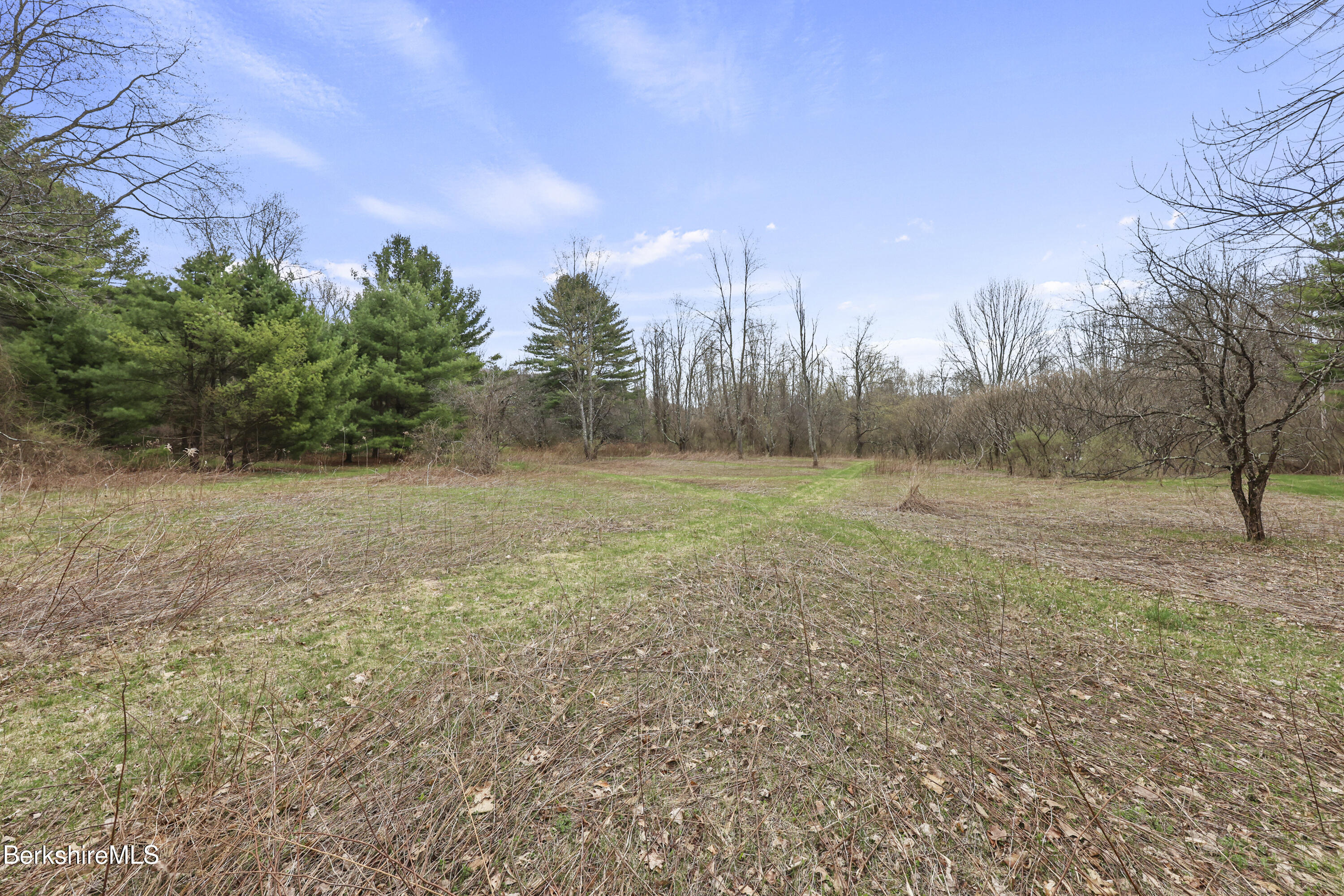 0 Lenox Road West Stockbridge, MA 01266 - Photo 5 of 18 a view of a field with trees in the background