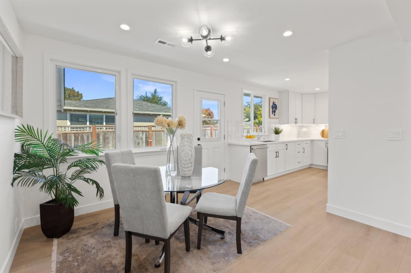 1384 Solano Drive Pacifica, CA 94044 - Photo 11 of 45 a view of a dining room with furniture and a potted plant