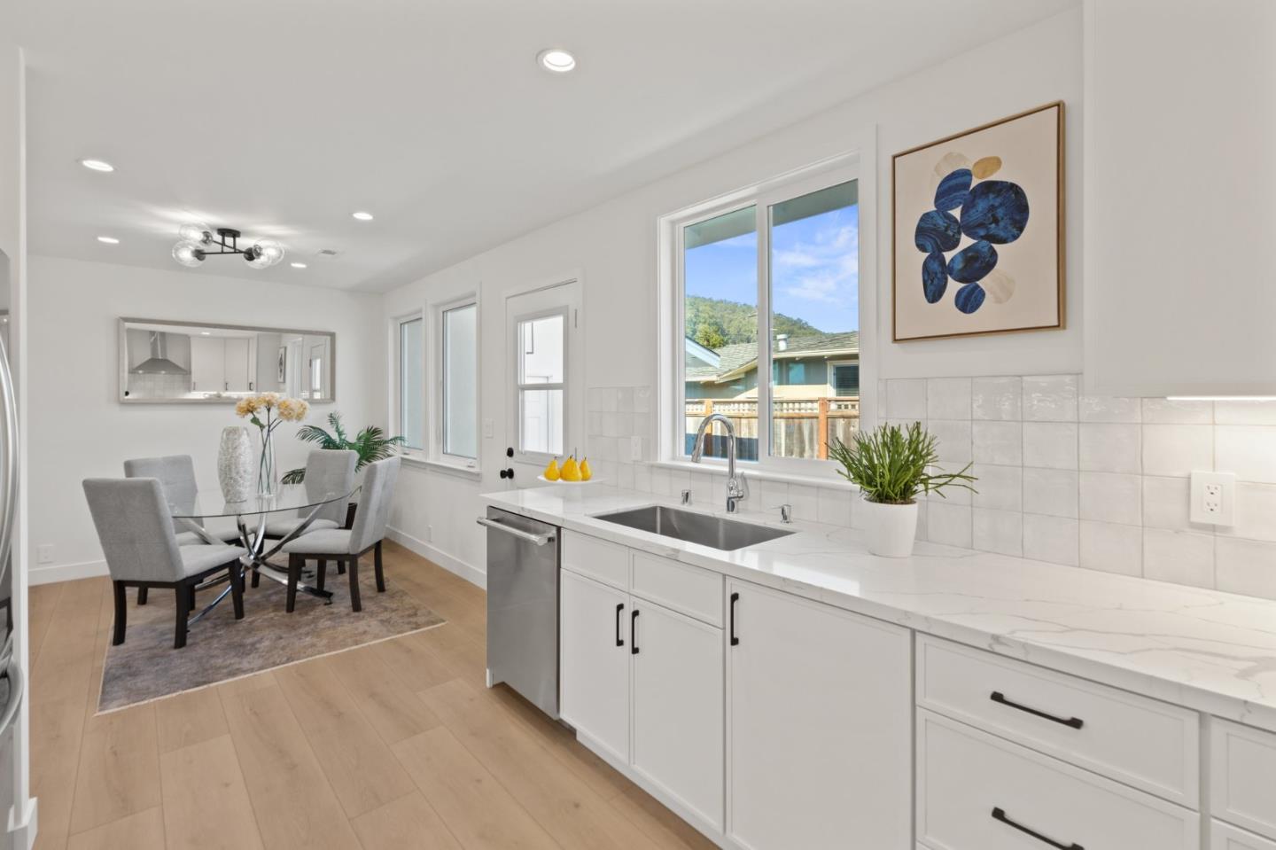 1384 Solano Drive Pacifica, CA 94044 - Photo 16 of 45 a view of a kitchen area with furniture and wooden floor