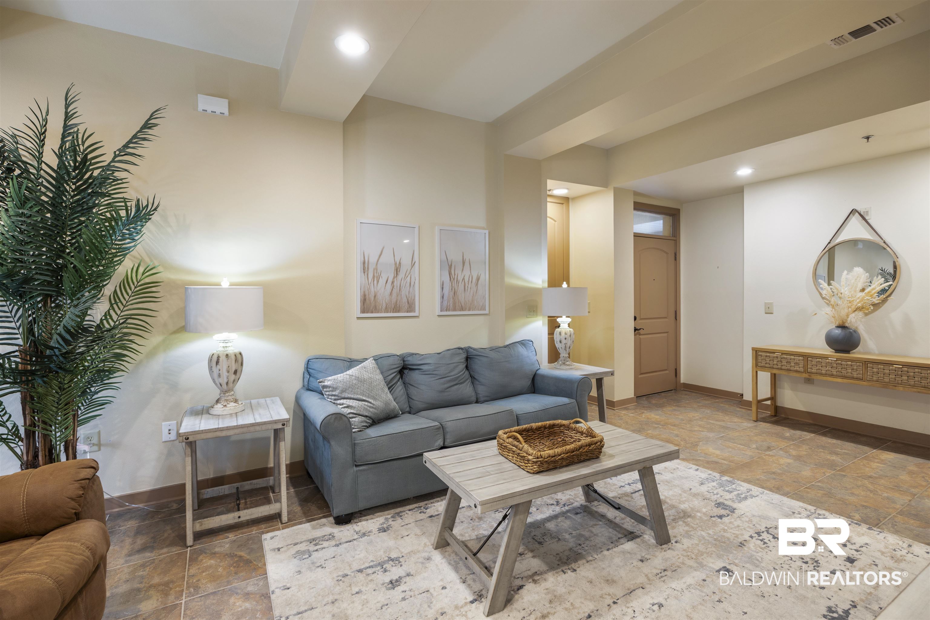 1430 Regency Road, Unit B201 Gulf Shores, AL 36542 - Photo 9 of 59 Living area featuring recessed lighting and stone finish flooring