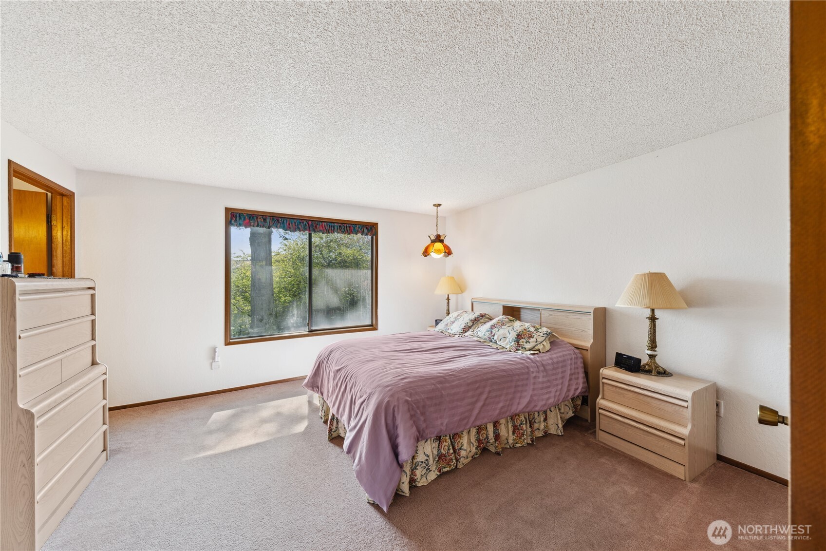 4314 Bryce Drive Anacortes, WA 98221 - Photo 11 of 40 a bedroom with a bed and a window