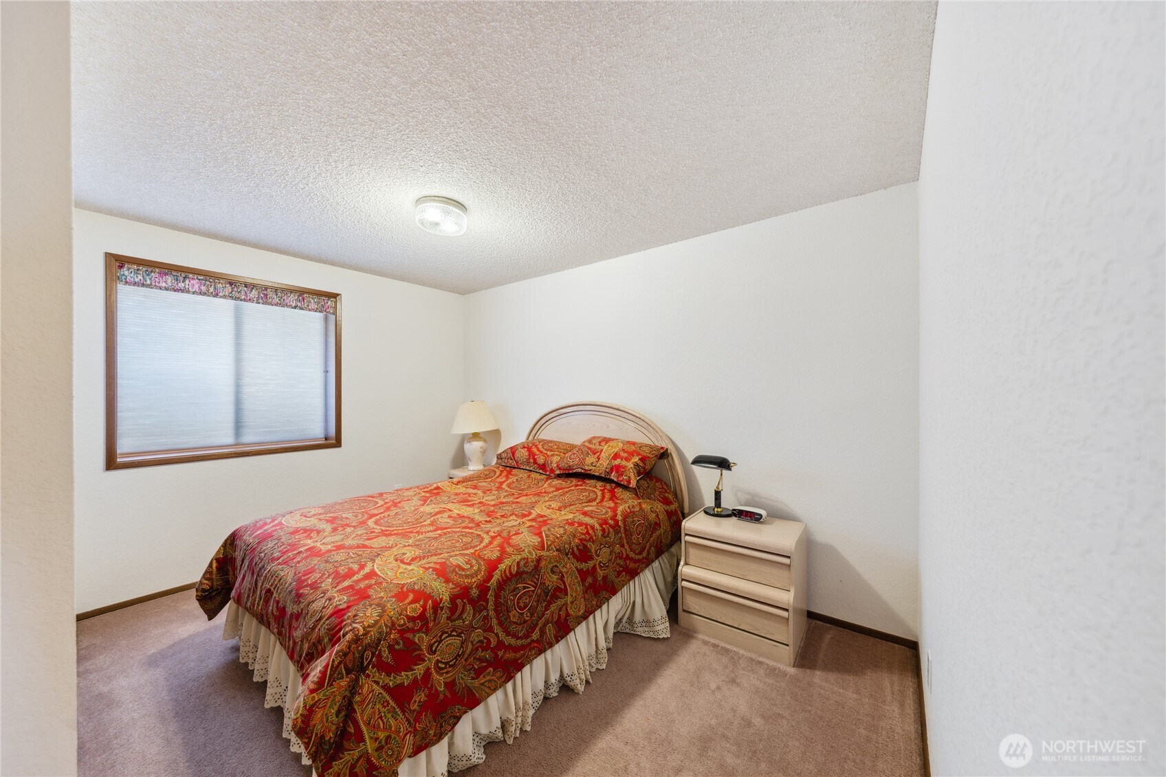 4314 Bryce Drive Anacortes, WA 98221 - Photo 14 of 40 a bedroom with a bed and a window