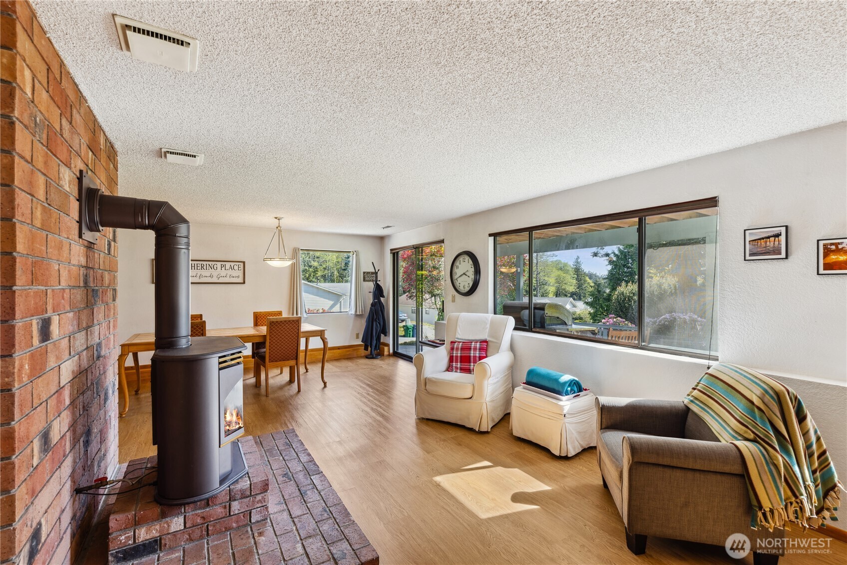 4314 Bryce Drive Anacortes, WA 98221 - Photo 16 of 40 a living room with furniture and a floor to ceiling window