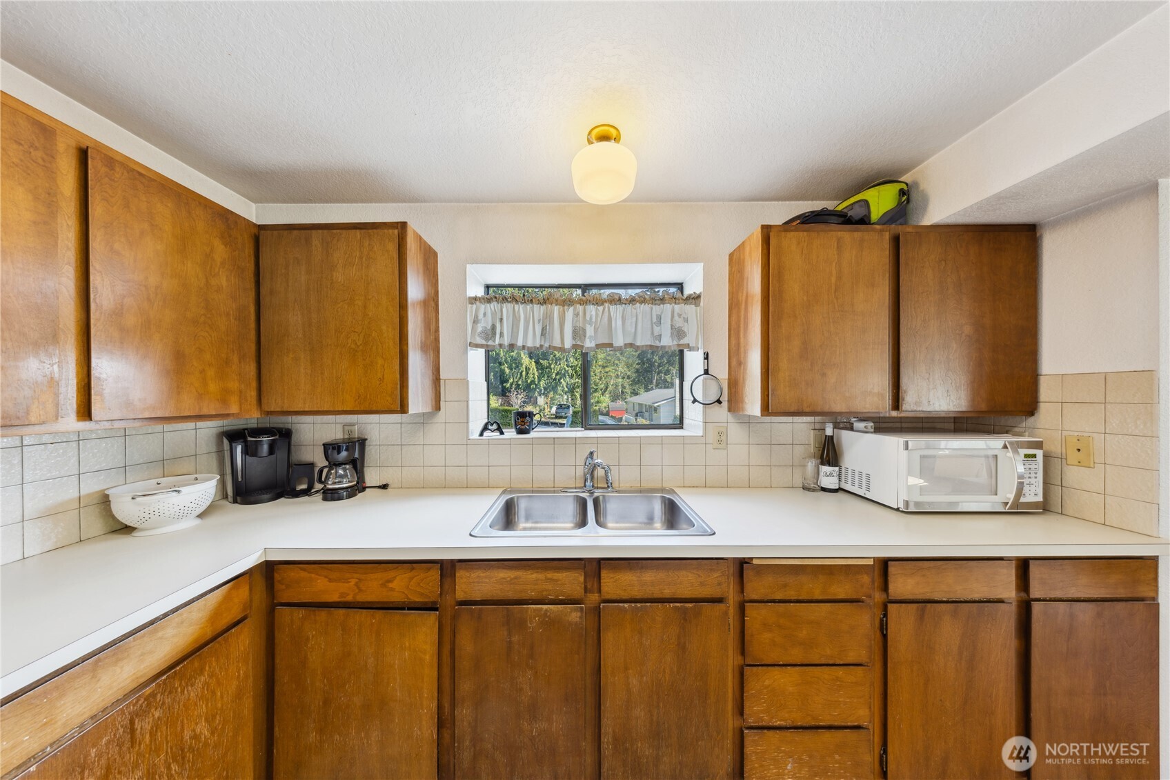 4314 Bryce Drive Anacortes, WA 98221 - Photo 24 of 40 a bathroom with a sink and a mirror