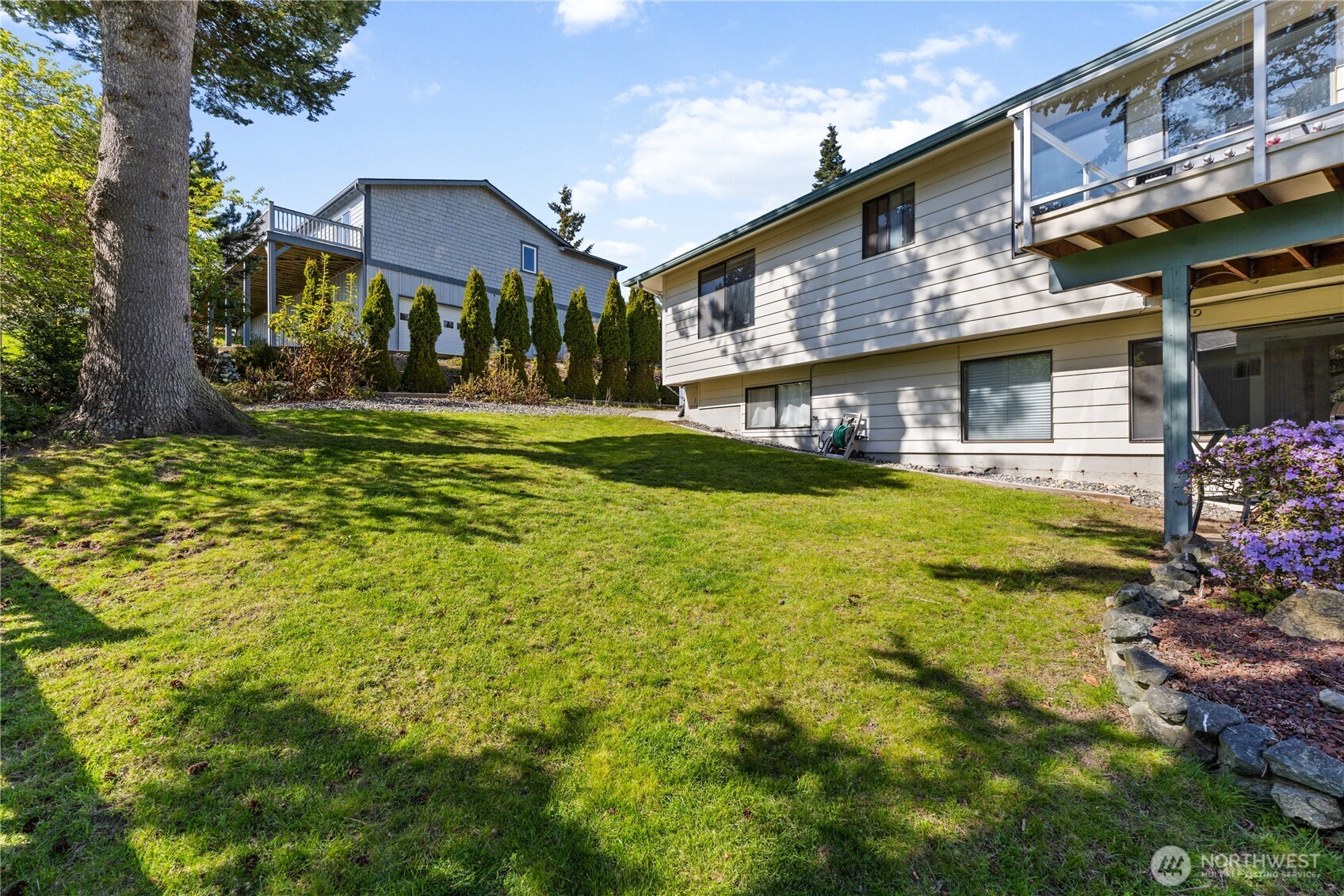 4314 Bryce Drive Anacortes, WA 98221 - Photo 31 of 40 a view of a house with a yard and plants