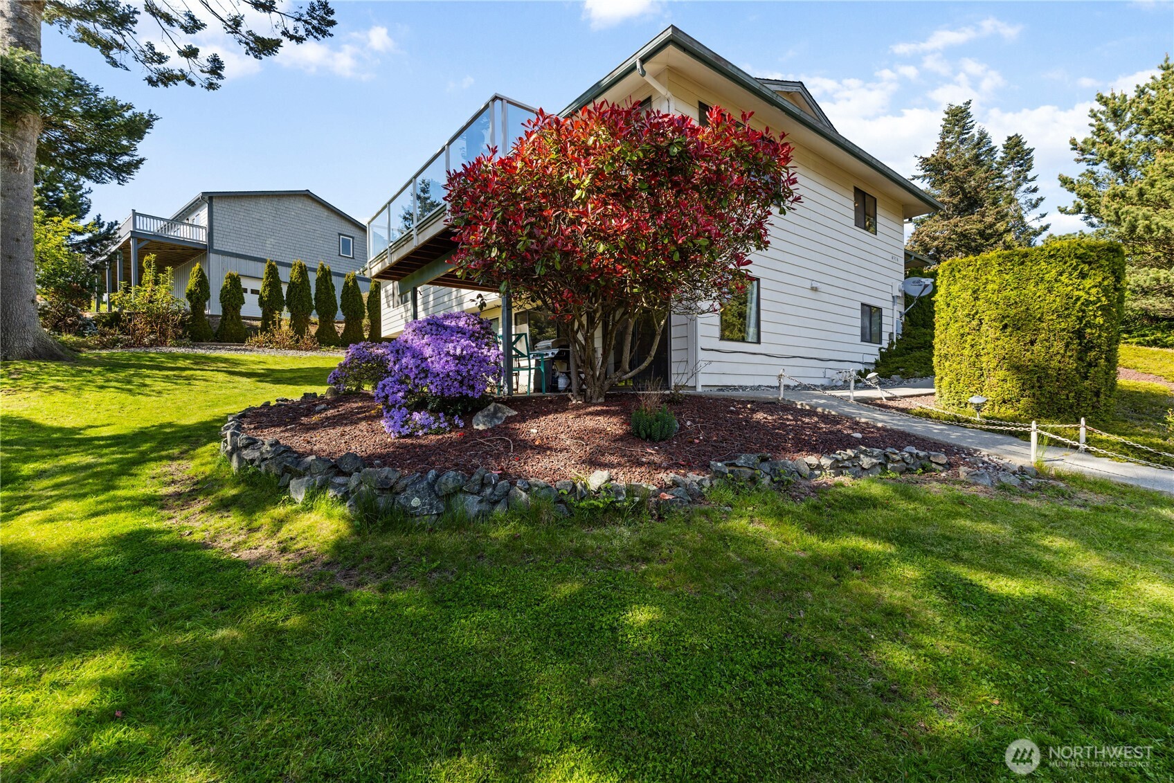 4314 Bryce Drive Anacortes, WA 98221 - Photo 33 of 40 a front view of a house with a yard