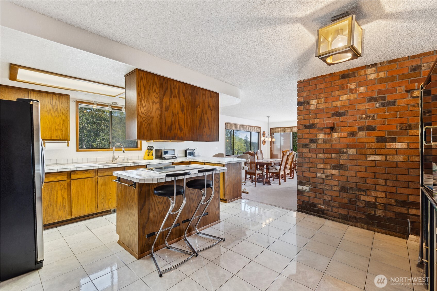 4314 Bryce Drive Anacortes, WA 98221 - Photo 7 of 40 a kitchen with stainless steel appliances granite countertop a sink and cabinets