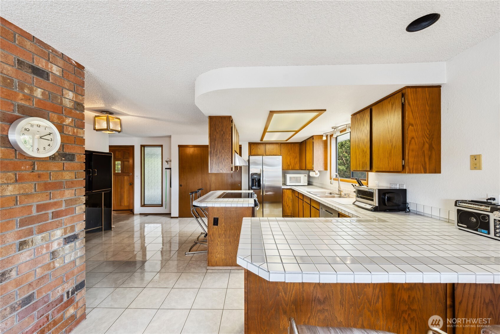 4314 Bryce Drive Anacortes, WA 98221 - Photo 9 of 40 a living room with patio furniture and a fireplace