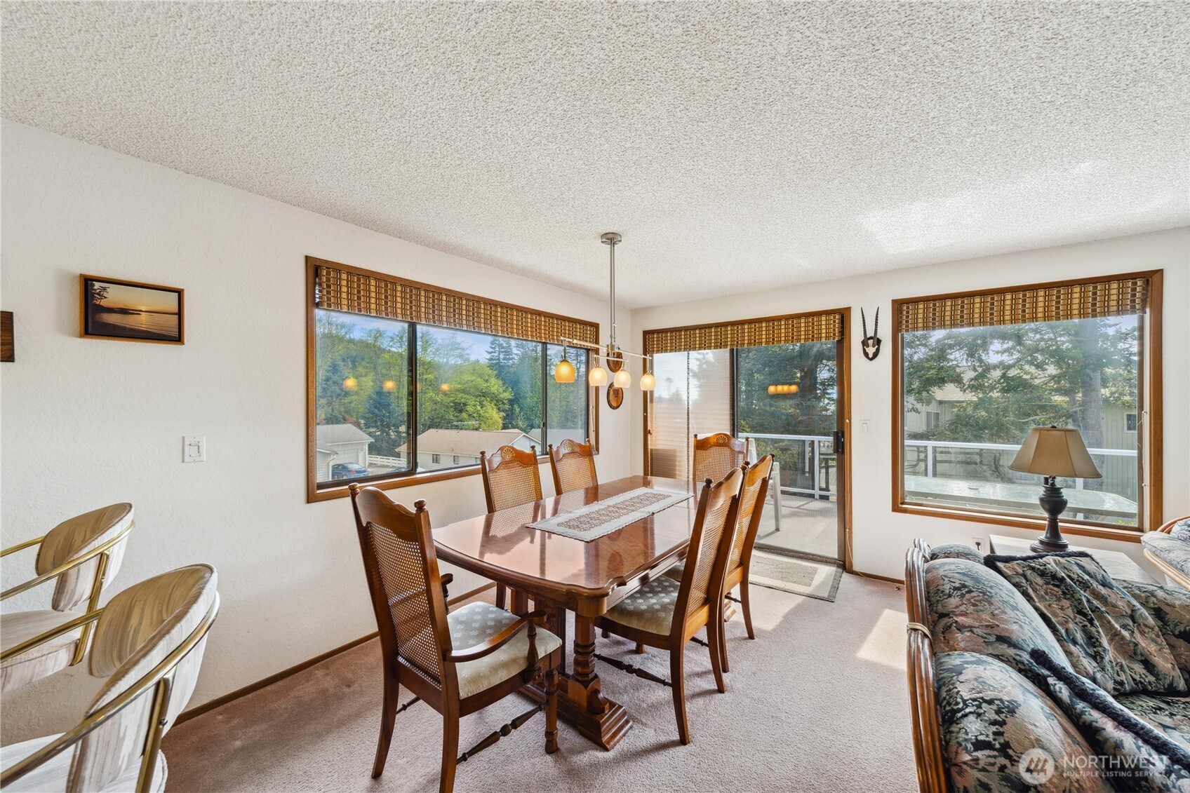 4314 Bryce Drive Anacortes, WA 98221 - Photo 10 of 40 a view of a dining room with furniture large windows and outside view