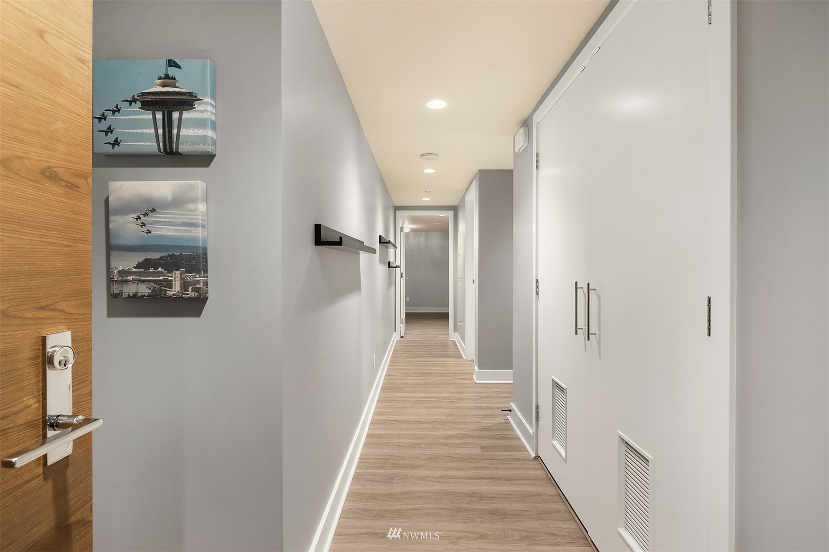 588 Bell Street, Unit 814S Seattle, WA 98121 - Photo 12 of 37 a view of a hallway with wooden floor and staircase