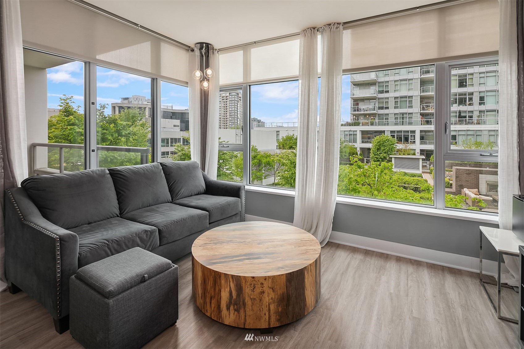 588 Bell Street, Unit 814S Seattle, WA 98121 - Photo 5 of 37 a living room with furniture and a large window