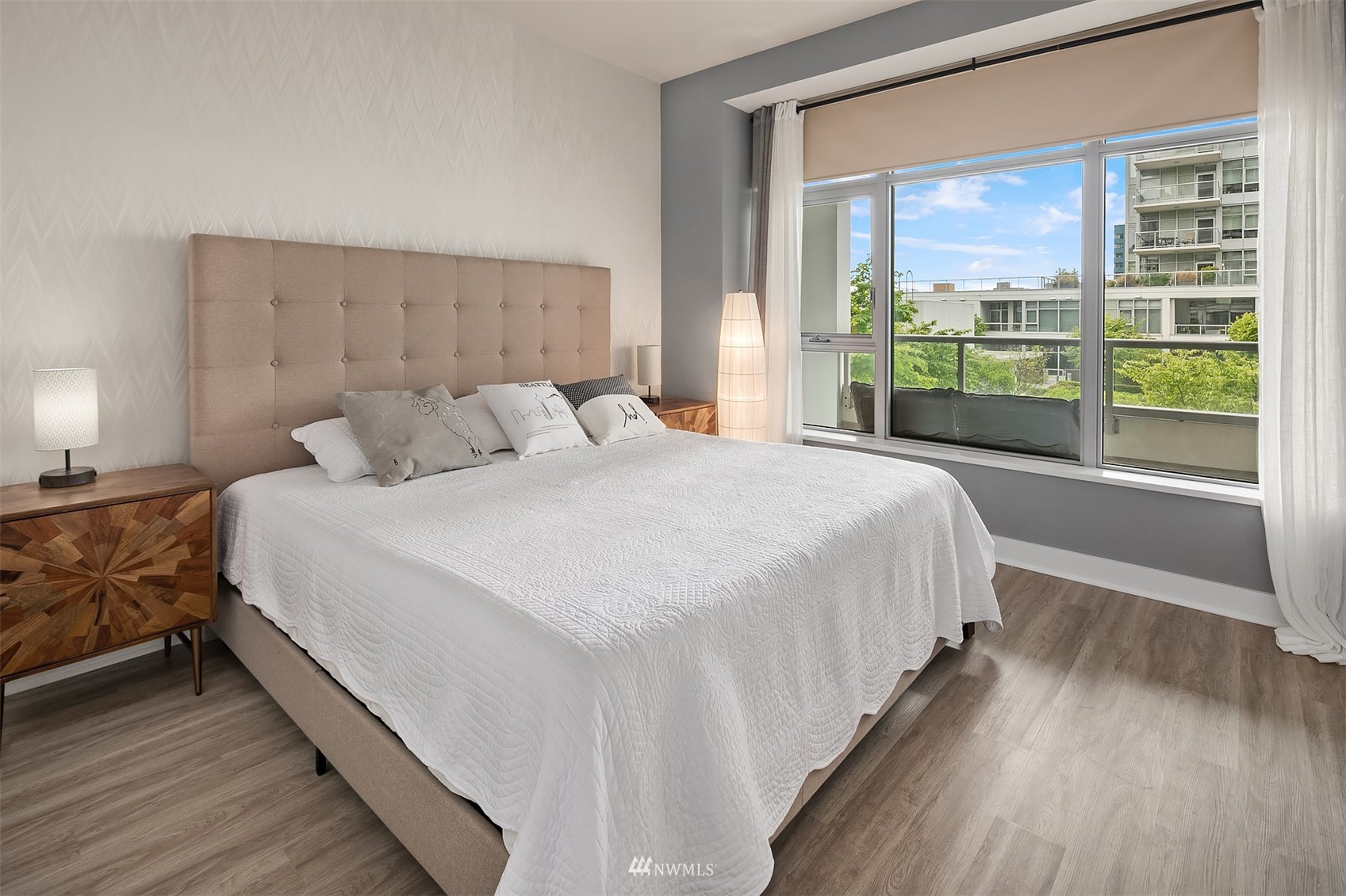 588 Bell Street, Unit 814S Seattle, WA 98121 - Photo 8 of 37 a bedroom with a large bed and a large window