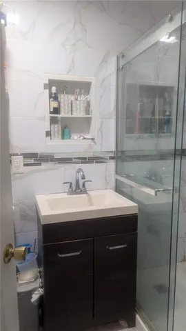 a bathroom with a sink and a mirror