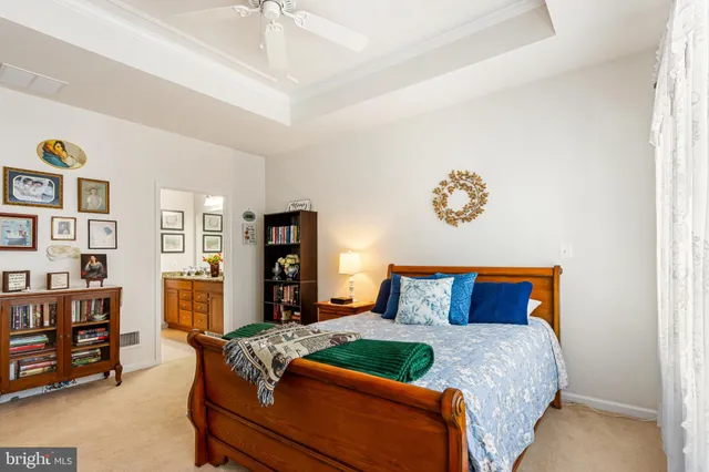 a bedroom with a bed and dresser