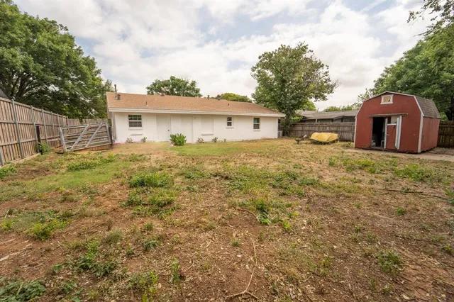 a backyard of a house with lots of green space