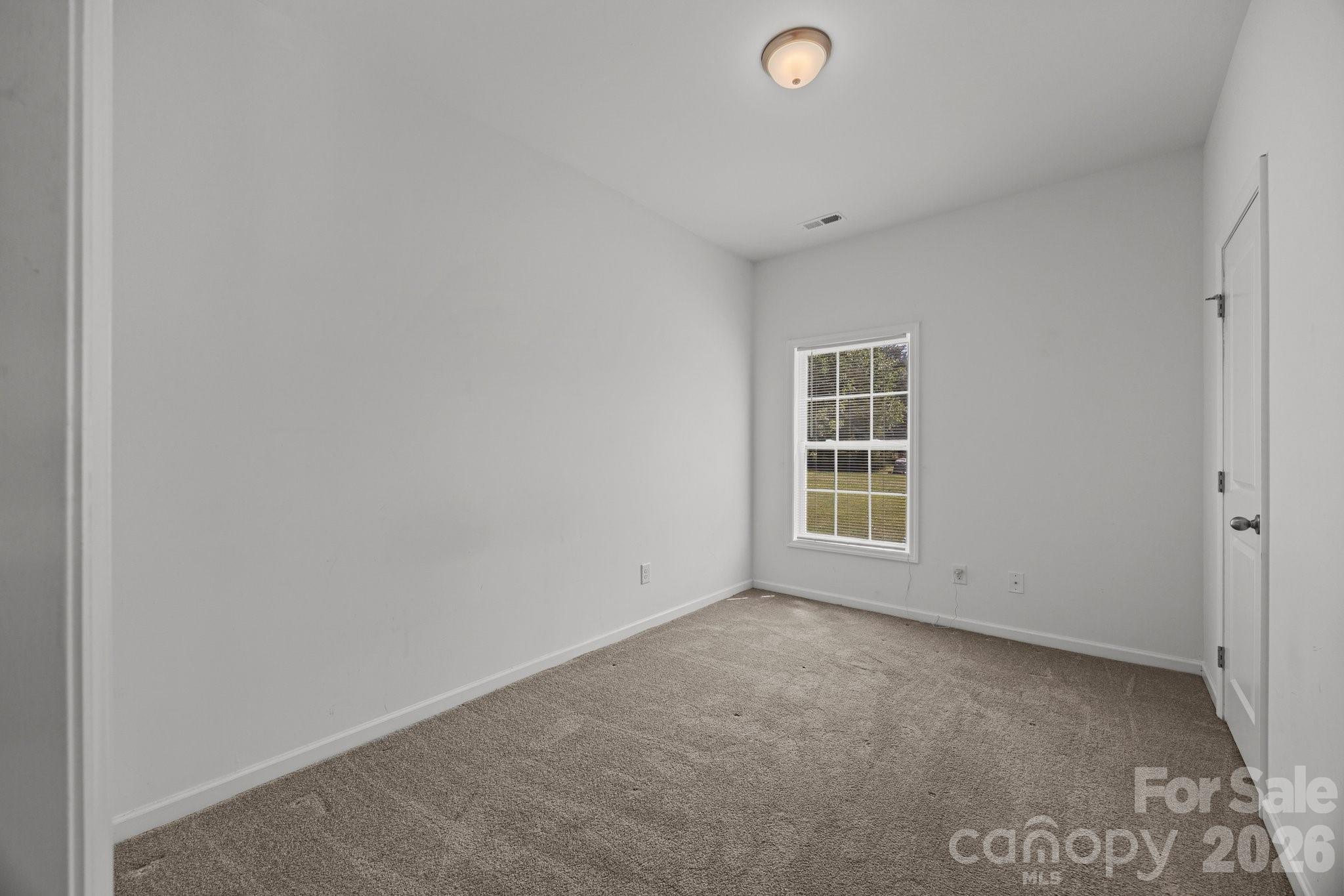 14532 East Rocky River Road Davidson, NC 28036 - Photo 30 of 32 a view of empty room with windows