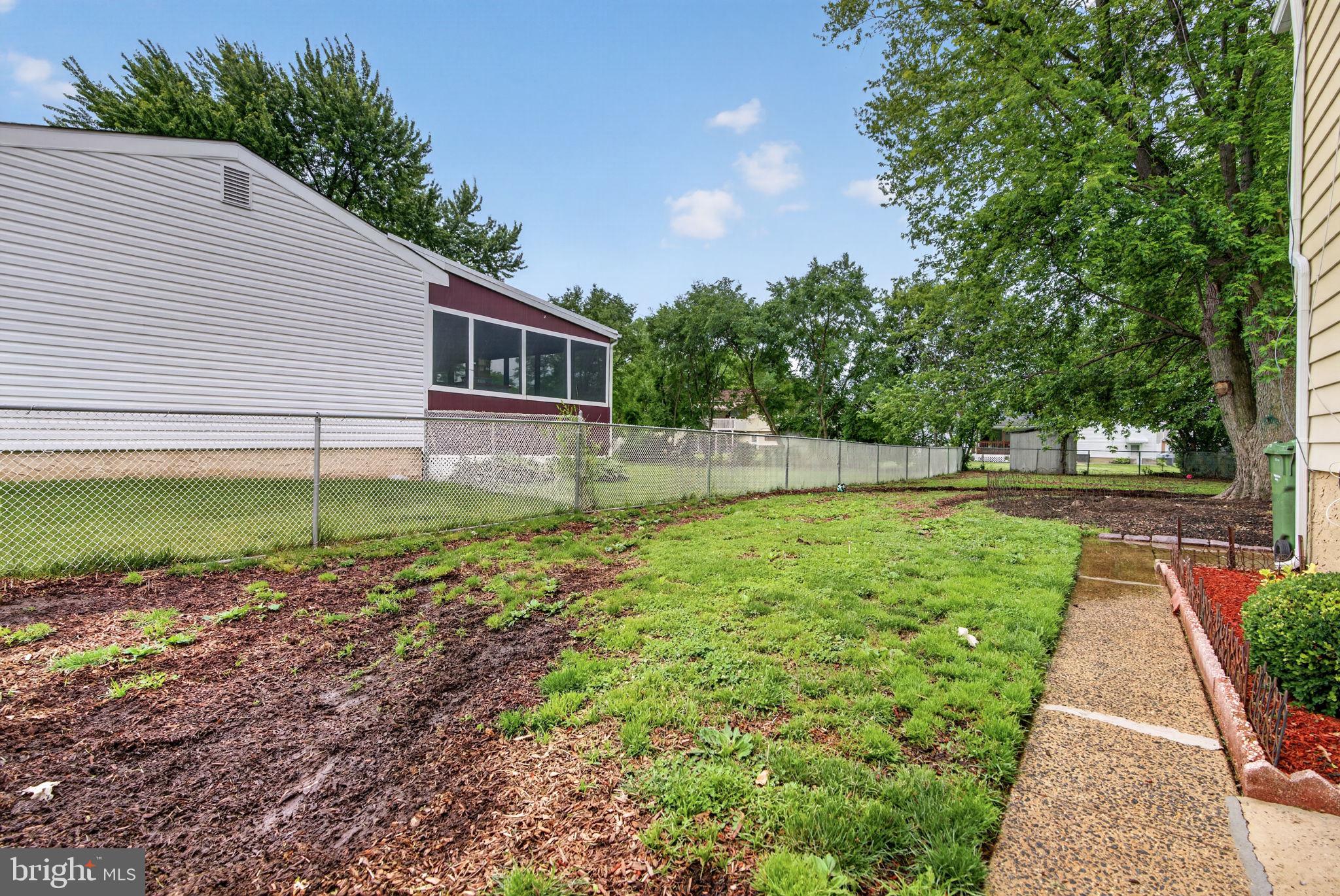 46 Trinity Avenue Marlton, NJ 08053 - Photo 30 of 37 a view of a backyard with a garden