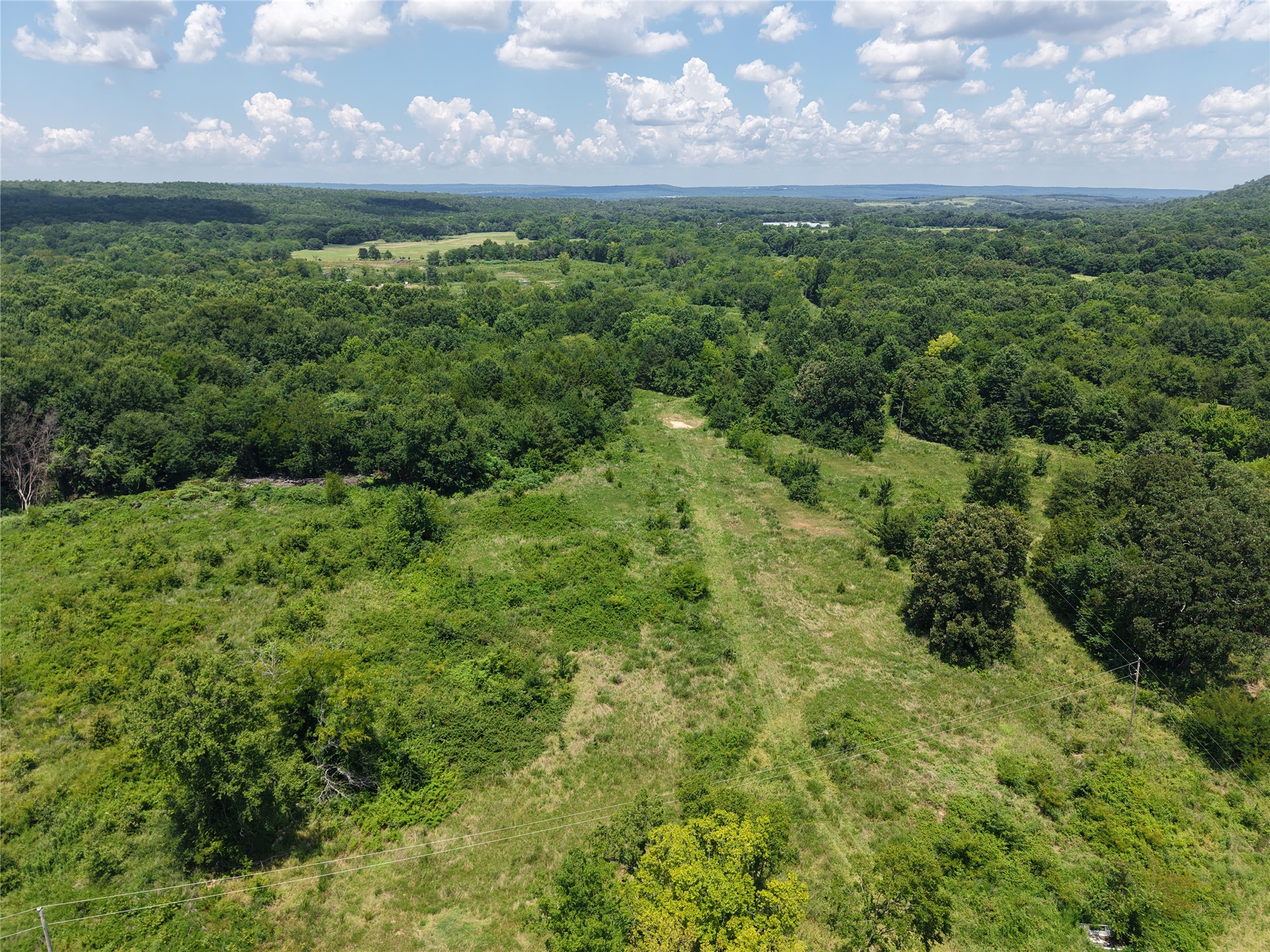 33594 Johnson Shady Point Shady Point, OK 74956 - Photo 7 of 18 Expansive land featuring diverse topography with wooded areas and open clearings