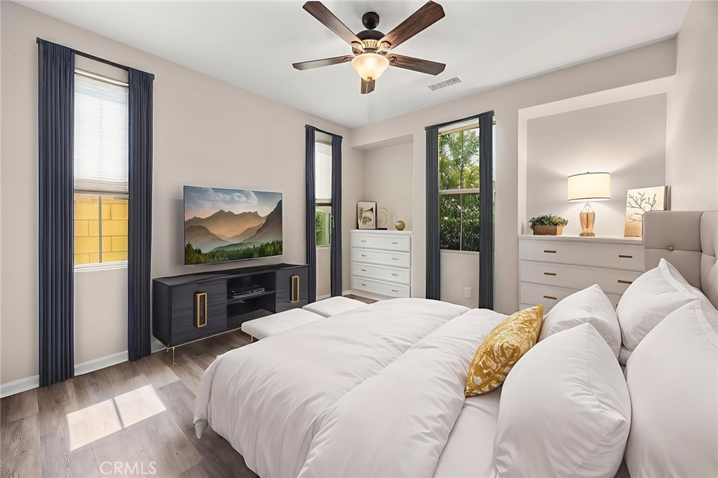 11362 Hutton Road Corona, CA 92883 - Photo 13 of 31 a bedroom with a bed and a flat screen tv