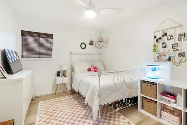 a bedroom with a bed and a couch