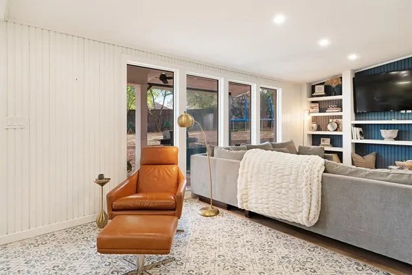 a view of a house with a backyard and porch