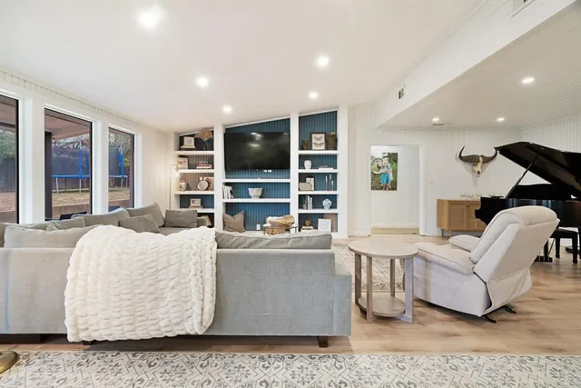 a living room with a couch and a flat screen tv
