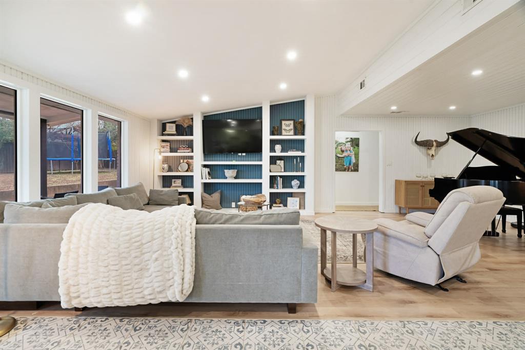 3350 Robin Road Paris, TX 75460 - Photo 2 of 21 a living room with a couch and a flat screen tv