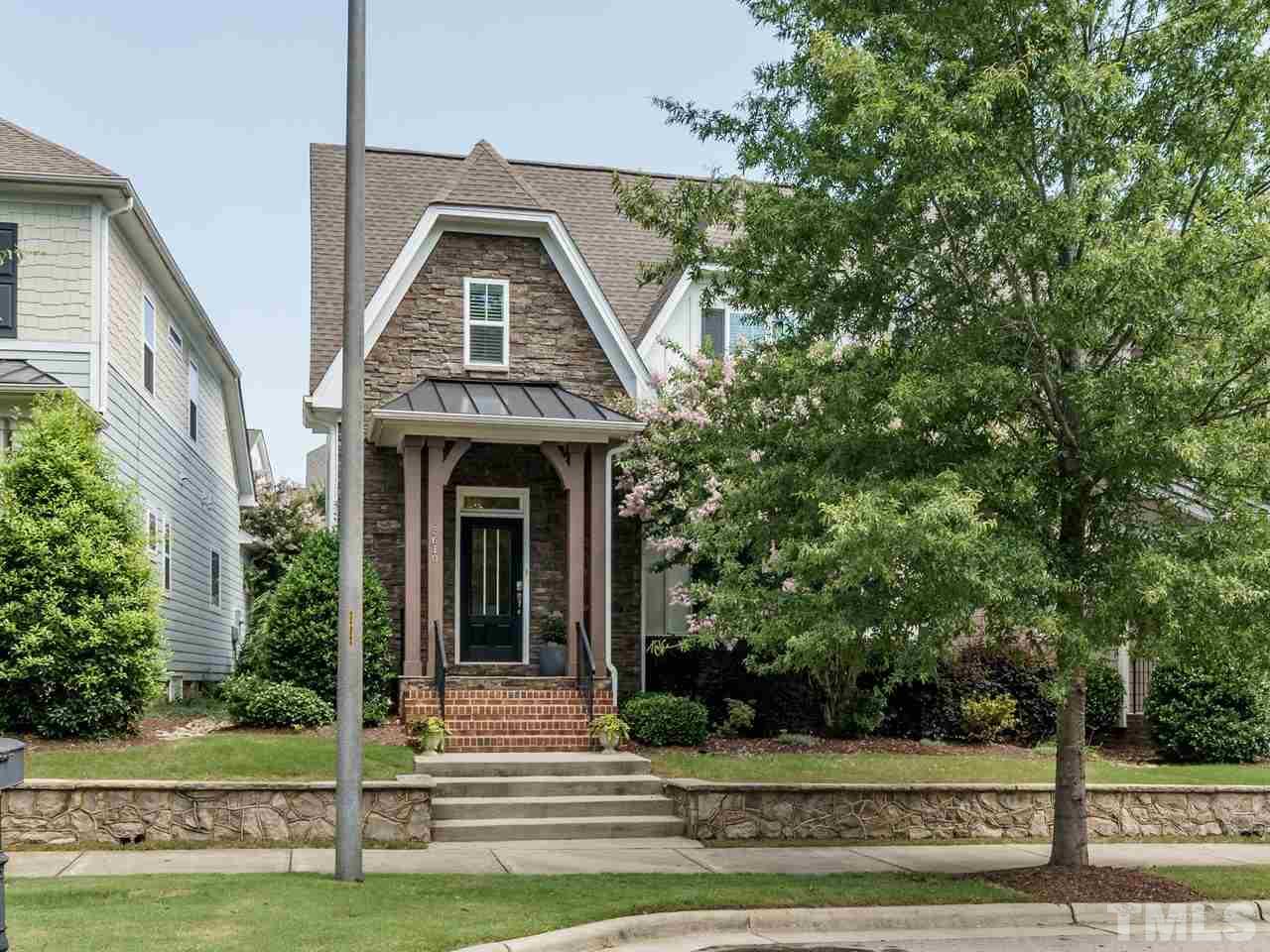 5610 Wade Park Boulevard Raleigh, NC 27607 - Photo 1 of 30 a view of a house with a small yard plants and large tree