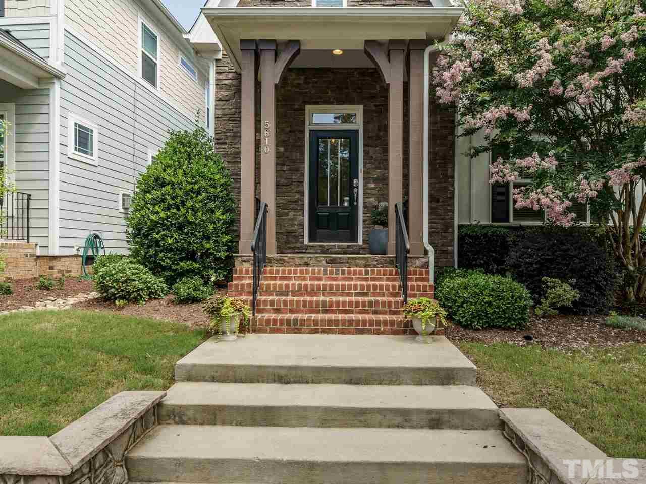5610 Wade Park Boulevard Raleigh, NC 27607 - Photo 3 of 30 a front view of a house with a garden