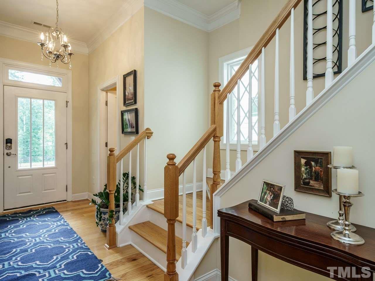 5610 Wade Park Boulevard Raleigh, NC 27607 - Photo 4 of 30 a view of entryway and hall with wooden floor