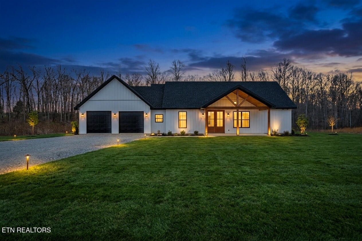 1468 Taylor Place Road Jamestown, TN 38556 - Photo 1 of 27 a front view of a house with a yard