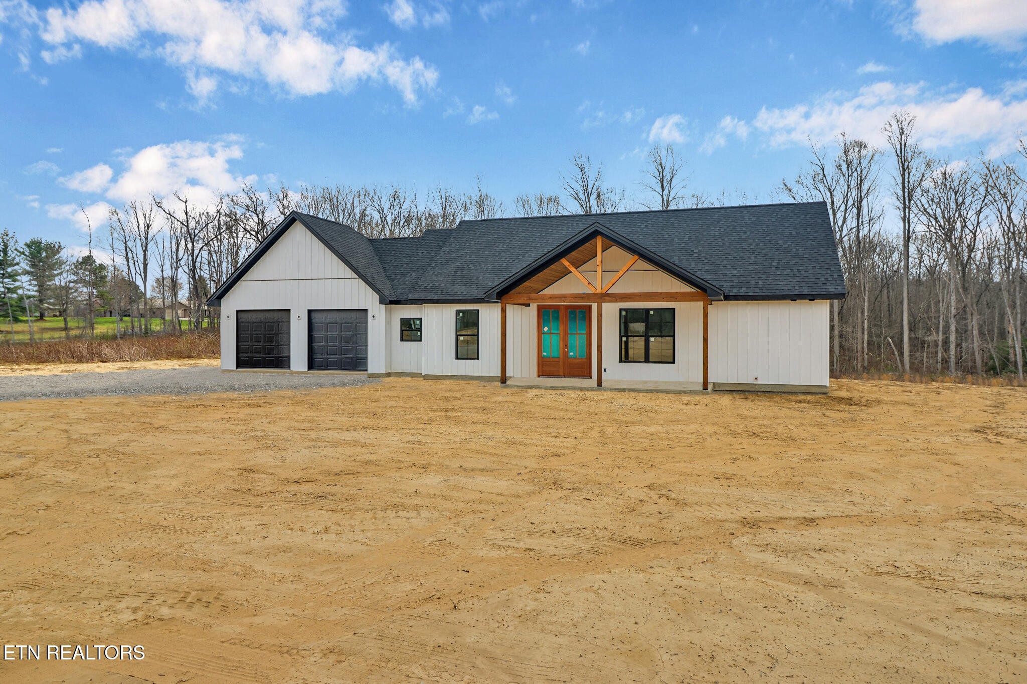 1468 Taylor Place Road Jamestown, TN 38556 - Photo 3 of 27 a front view of a house with a yard