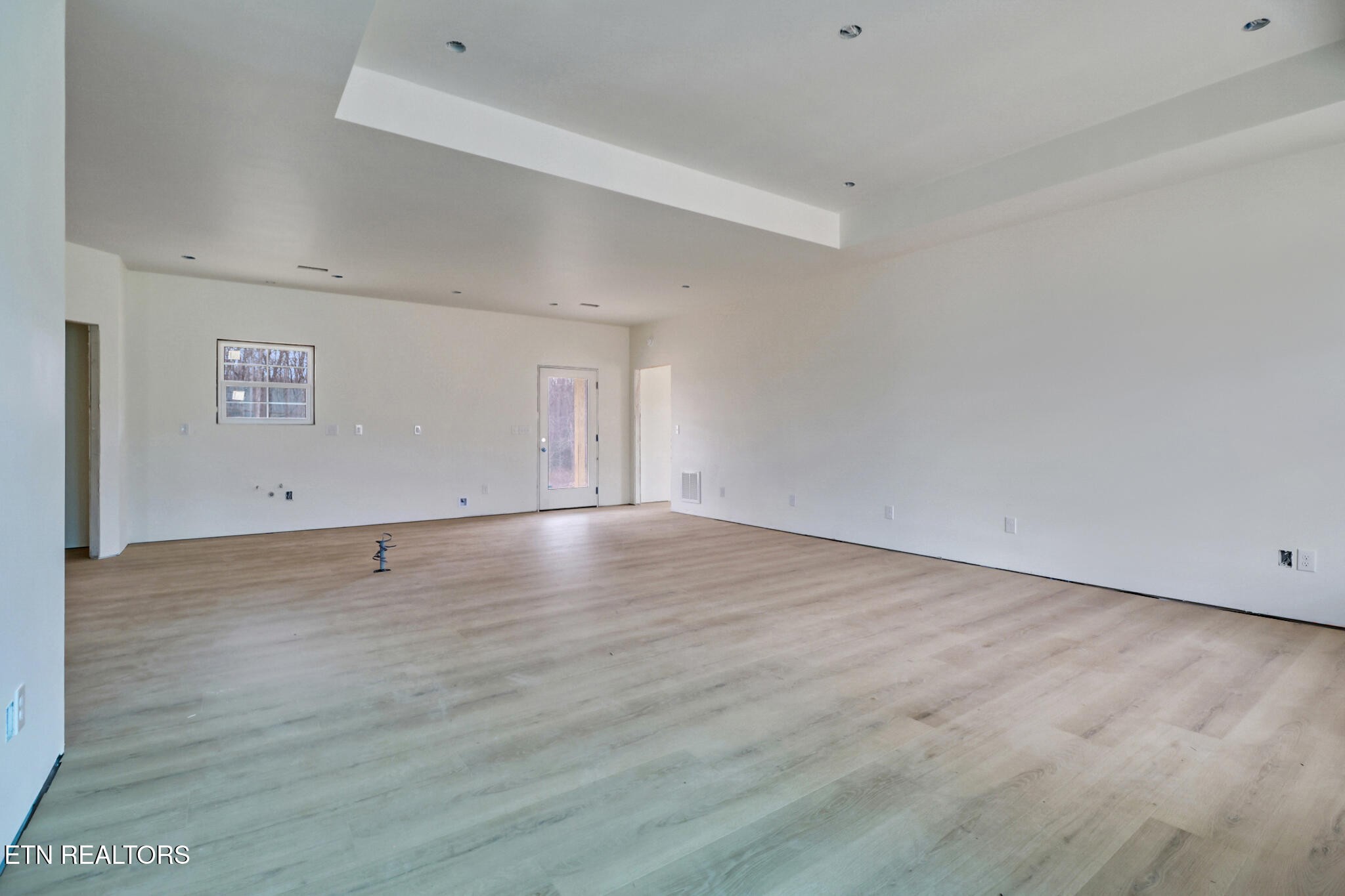1468 Taylor Place Road Jamestown, TN 38556 - Photo 6 of 27 a view of an empty room with wooden floor