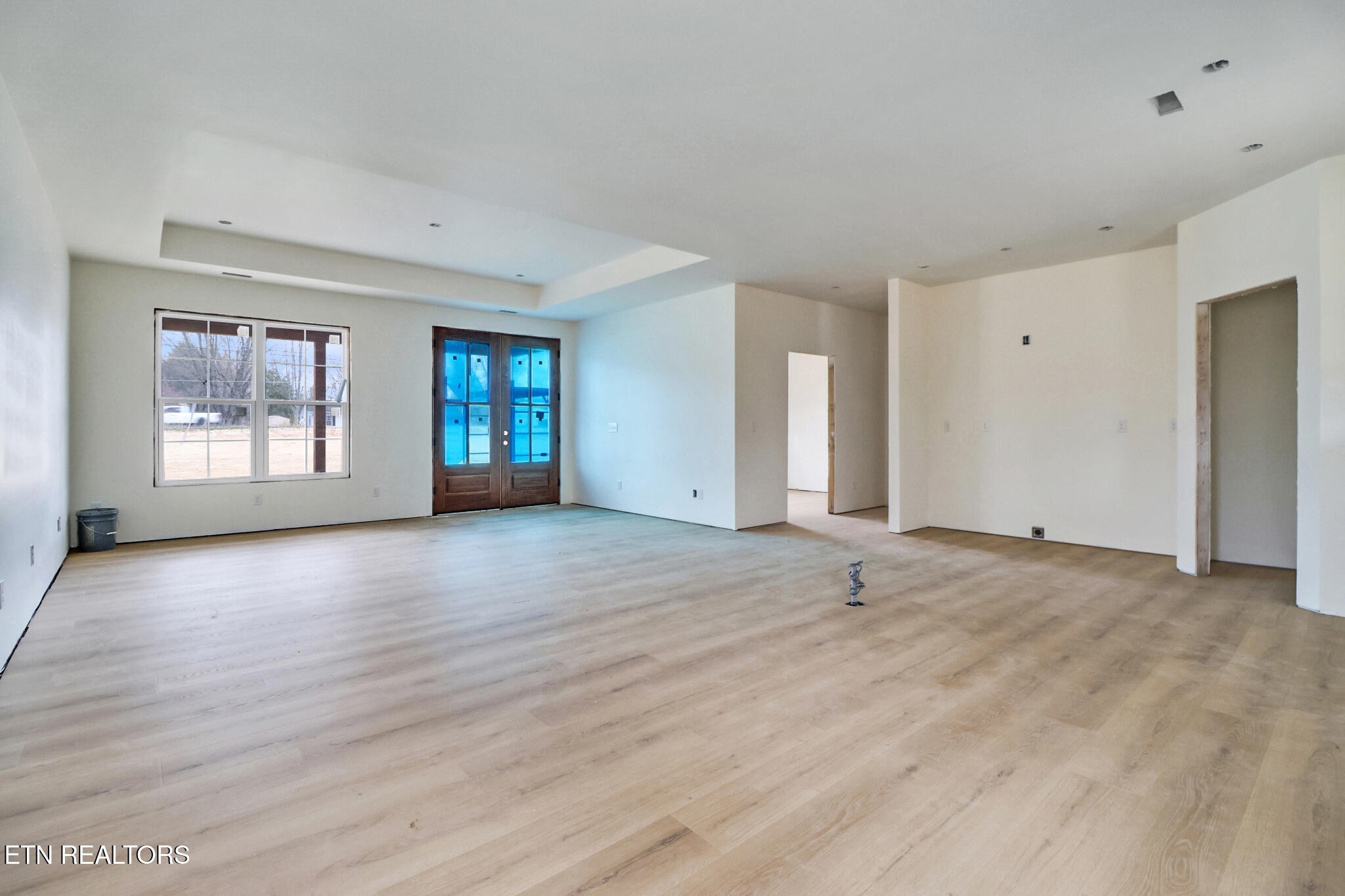 1468 Taylor Place Road Jamestown, TN 38556 - Photo 7 of 27 a view of an empty room with wooden floor and a window