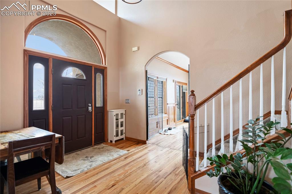 20880 Scott Road Calhan, CO 80808 - Photo 11 of 39 a view of a hallway with entryway wooden floor and front door