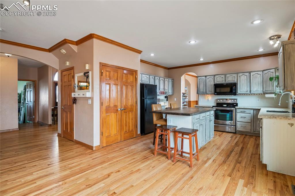 20880 Scott Road Calhan, CO 80808 - Photo 13 of 39 a kitchen with stainless steel appliances granite countertop a refrigerator stove top oven and sink