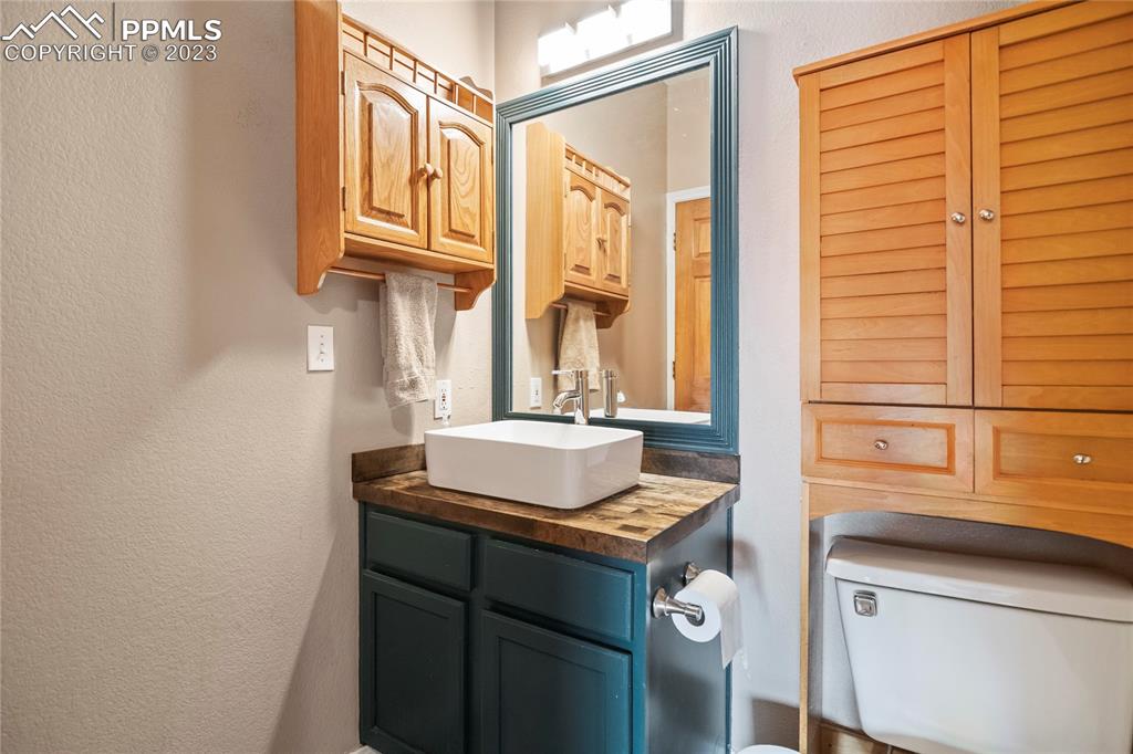 20880 Scott Road Calhan, CO 80808 - Photo 18 of 39 a bathroom with a sink and a mirror