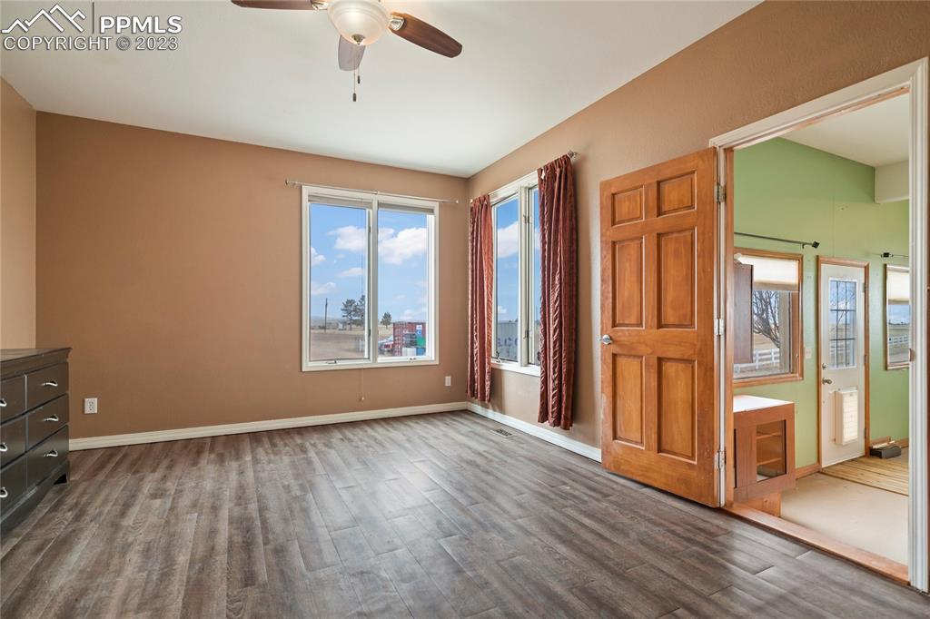 20880 Scott Road Calhan, CO 80808 - Photo 19 of 39 a view of an empty room with glass door