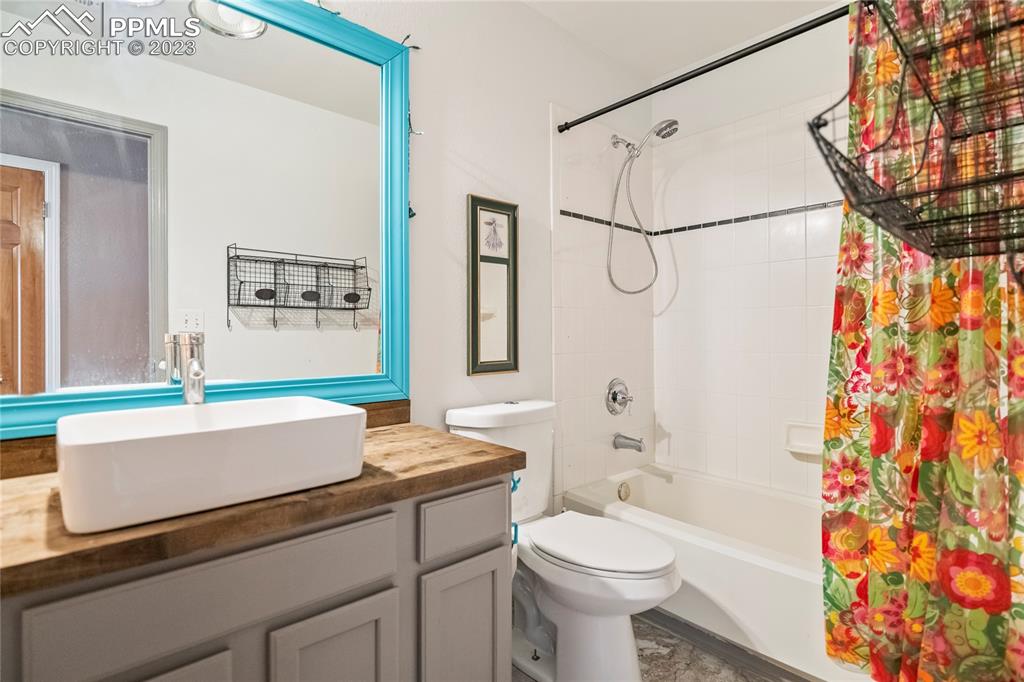 20880 Scott Road Calhan, CO 80808 - Photo 25 of 39 a bathroom with a granite countertop sink toilet and shower