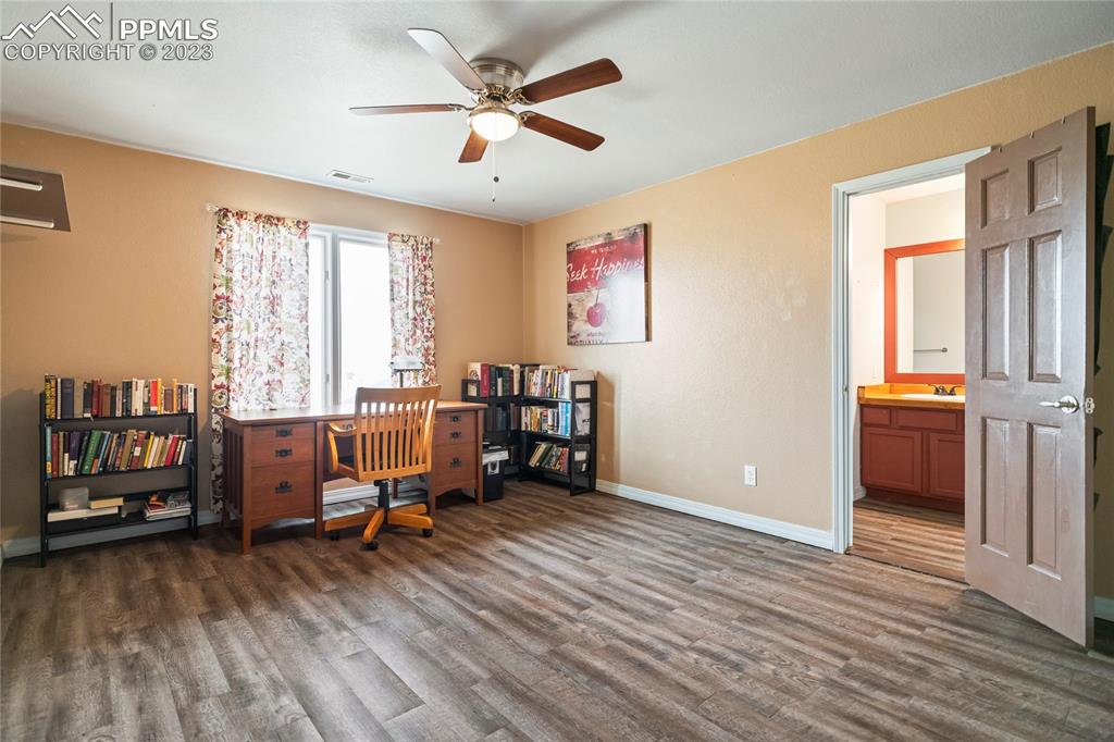 20880 Scott Road Calhan, CO 80808 - Photo 26 of 39 a view of a workspace with furniture and a window