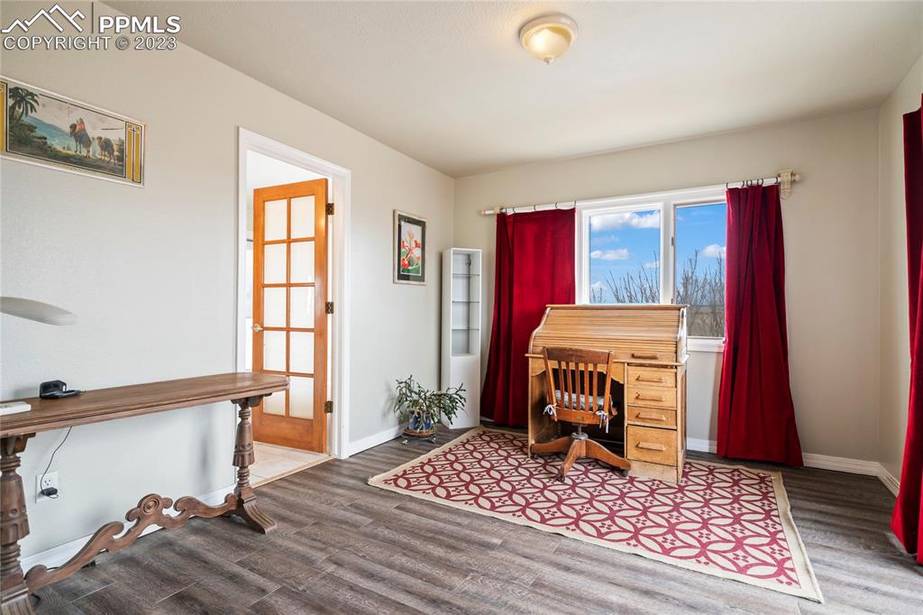 20880 Scott Road Calhan, CO 80808 - Photo 31 of 39 a bedroom with a bed and a window