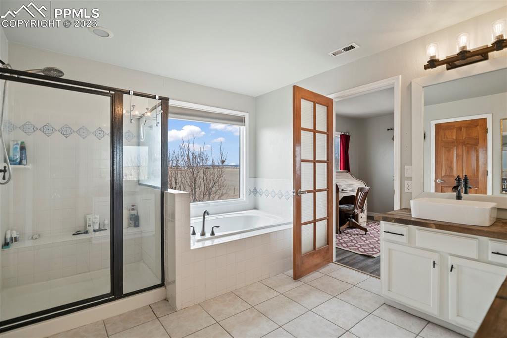 20880 Scott Road Calhan, CO 80808 - Photo 33 of 39 a spacious bathroom with a shower and a sink