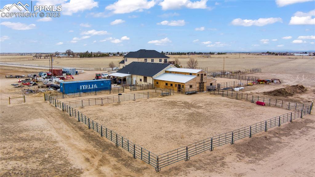 20880 Scott Road Calhan, CO 80808 - Photo 6 of 39 a terrace with a table and chairs with wooden floor and lake view