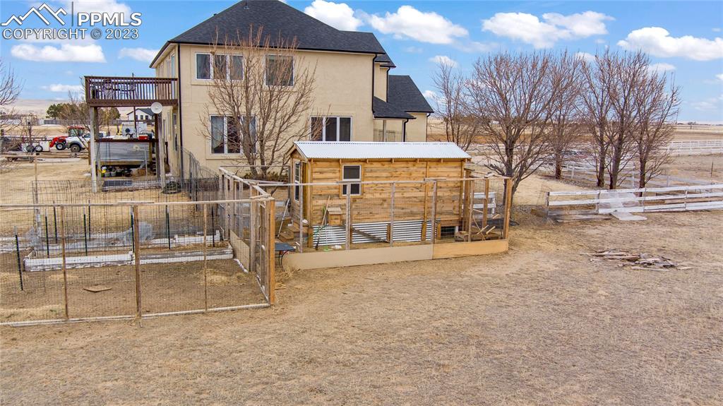 20880 Scott Road Calhan, CO 80808 - Photo 8 of 39 a view of a house with a outdoor space