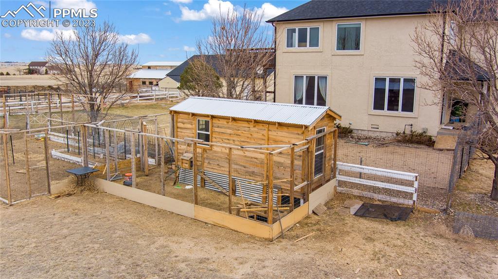 20880 Scott Road Calhan, CO 80808 - Photo 9 of 39 a view of a house with a wooden fence
