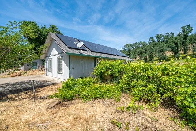 a house view with a backyard space